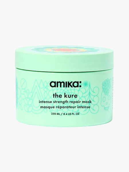 Amika The Kure Intense Strength Repair Mask in branded tub component on a light gray background